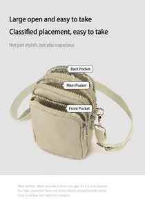 Detailed view of the three zipper compartments on the nylon crossbody phone bag