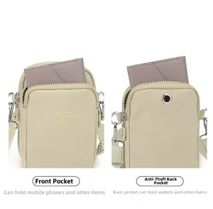 Nylon crossbody bag detail showing front phone pocket and anti-theft rear pocket