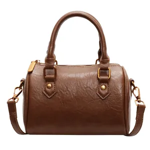 Classic dark brown Boston handbag in matte faux leather with vintage gold hardware