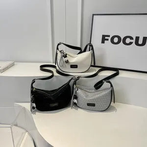 Three crescent shoulder bags in black, white and silver grey with stylish grid texture