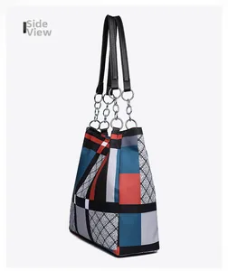 Side view of multi-color nylon tote bag with geometric patterns and metallic chain straps