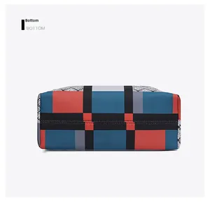 Detailed bottom view of large tote bag featuring modern colorful geometric color-block pattern