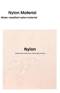 Detail of pink waterproof nylon fabric showing water droplets on a high-density surface