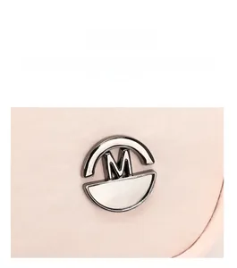 Polished metal M FASHION logo detail on light pink nylon fabric of a crossbody bag