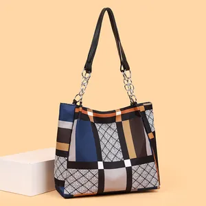 Diamond lattice tote bag with chic chain strap in blue and beige color block design
