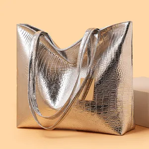 Silver metallic tote bag with crocodile texture and long shoulder straps for daily commuting