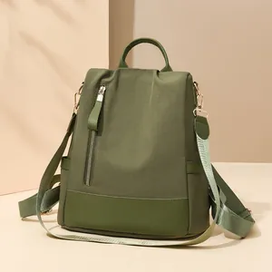 Sac à dos antivol chic pour femme vert foncé avec bordures en cuir et sangle tissée