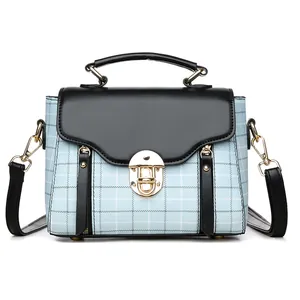 Retro patchwork plaid crossbody bag with blue fabric, black leather and gold buckle