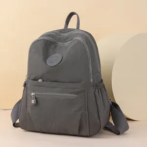 Fashionable dark grey multi-pocket nylon backpack with durable sport zippers for women