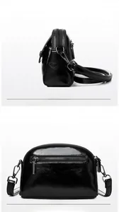 Dettaglio fronte e retro di una mini borsa a tracolla in pelle nera lucida con cerniere