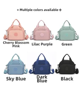 Detail view of large nylon shoulder bags available in six vibrant fashion colors