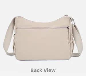 Vue arrière du sac bandoulière en nylon beige avec poche zippée et poches latérales
