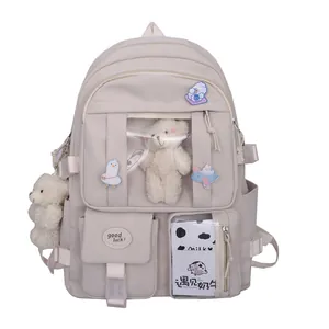 Süßer beiger Oxford-Rucksack mit kleinen Bärenanhängern und transparentem Fensterfach
