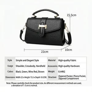 Black pebbled leather crossbody bag with gold H-buckle shown with size specs