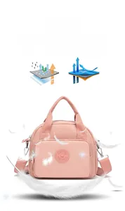 Detail of water-resistant nylon bag showing tear-resistant fabric and pink exterior