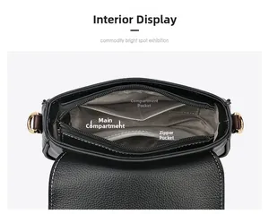 Detailed interior of black leather crossbody bag showing compartments and lining