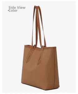 Front side view of a brown tote bag with detailed woven texture and leather handles