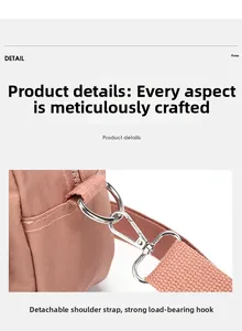 Detail of the detachable shoulder strap and silver metal hook on a pink nylon bag