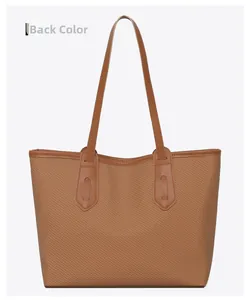 Back view of brown tote bag with woven texture and leather handle stitching detail