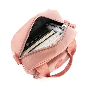 Pink nylon shoulder bag with large capacity and multi-layer storage for daily commute