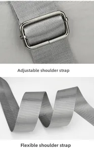 Detail of adjustable gray woven shoulder strap with silver metal buckle on nylon bag