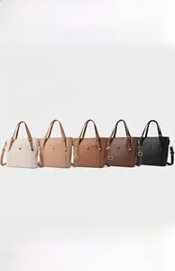 Collection of minimalist leather tote bags in five neutral colors with top handles
