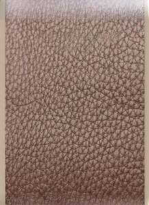 Close-up of premium coffee brown lychee pattern leather with a fine textured finish