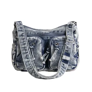 Sac bandoulière vintage en jean bleu délavé avec poches et sangle ajustable