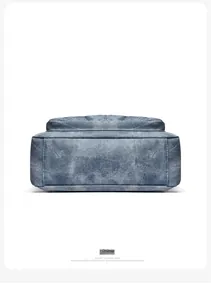Detail view of the durable blue denim shoulder bag base with premium stitching