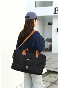Macro detail of large travel bag with brown strap and separate bottom shoe compartment