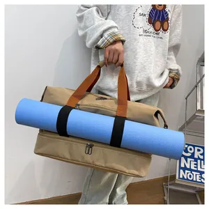 Detail of travel bag with yoga mat holder and separate bottom shoe compartment