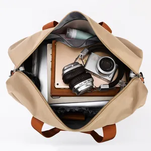 Large khaki canvas travel bag with spacious interior compartments and zipper closure