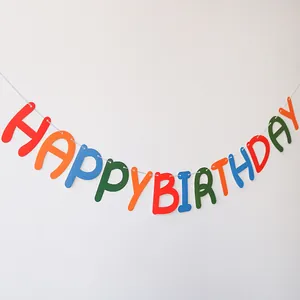 Close-up of colorful felt Happy Birthday banner featuring vibrant multicolor letters