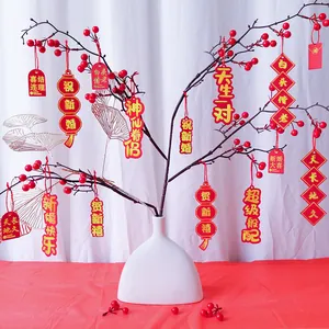Chinese wedding red pendants set with golden blessings in white ceramic vase