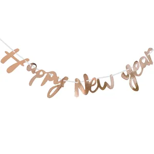 Hanging rose gold Happy New Year banner with metallic finish for festive party decorations