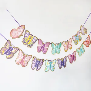 Detail of macaron butterfly Happy Birthday banner with golden glitter edges for party decor