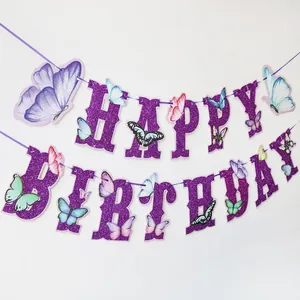 Close-up of purple glitter Happy Birthday banner with colorful butterfly cardstock details