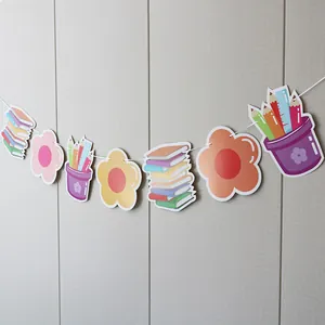 Detail of school themed animal banner with cartoon books and pencils for party decor