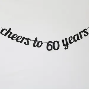 Detail of black Cheers to 60 Years banner for birthday and anniversary party wall decor