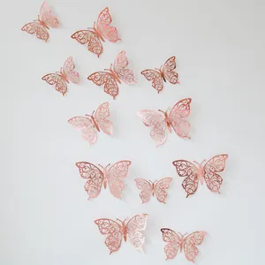 Detailed view of rose gold hollow butterfly wall stickers with 3D laser-cut vine patterns