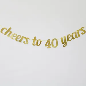 Detail of glittery gold 'cheers to 40 years' banner for birthday party decoration