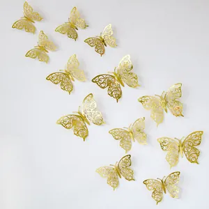 Detail of 3D gold hollow butterfly wall stickers with metallic texture for home decor