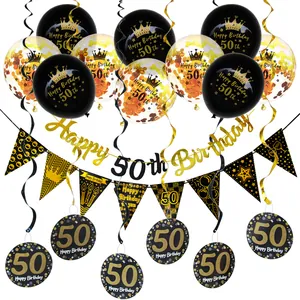 Close-up of black and gold 50th birthday party decorations with balloons and banner