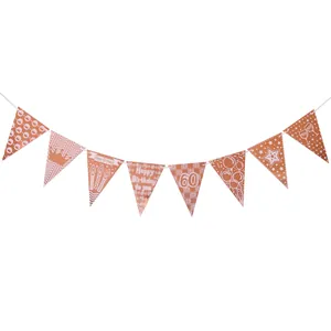 Rose gold 60th birthday party banner with metallic flags and festive party elements
