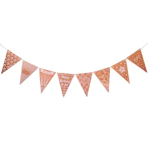 Rose gold 50th birthday party banner with metallic crown, balloon and candle designs