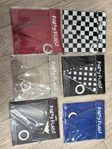 Detail of assorted party flags set featuring racing checkerboard and solid color banners