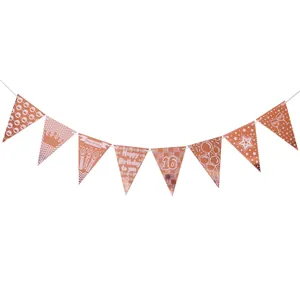 Close-up of rose gold 16th birthday bunting banner with metallic glitter finish