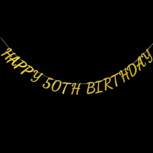Close-up of golden glitter Happy 50th Birthday banner hanging on black background