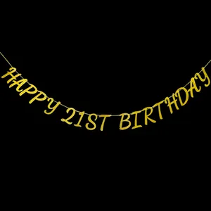 Glittering gold Happy 21st Birthday banner hanging on a black background