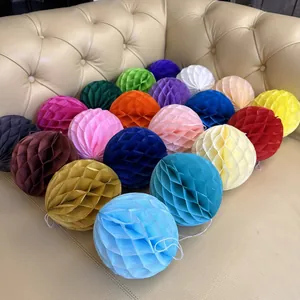 Close-up of colorful paper honeycomb balls with hanging loops for party decorations